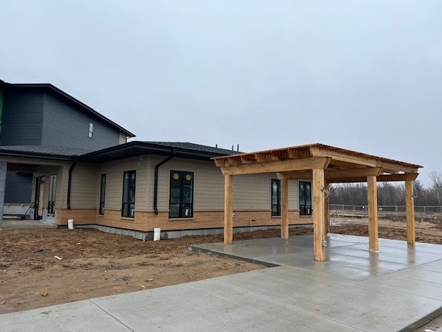 A house under construction with a covered patio.