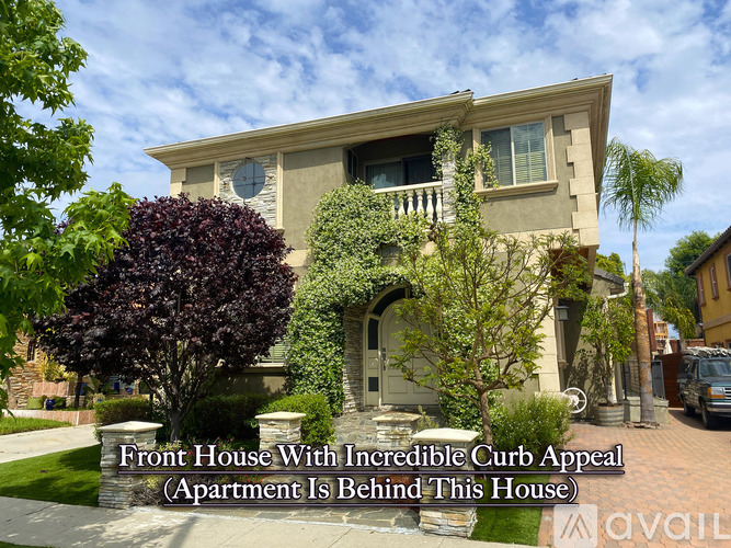 A front house with a curb appeal and an apartment behind it.