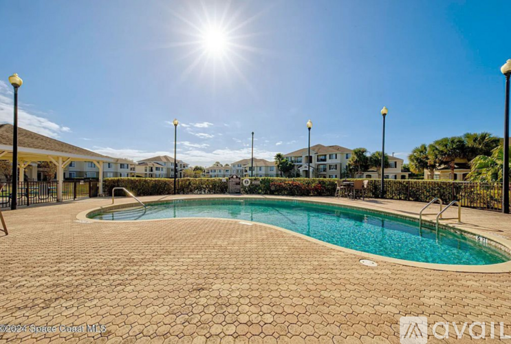 A sunny day at the pool with a clear blue sky.