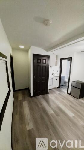 A room with wooden floors and a white ceiling.