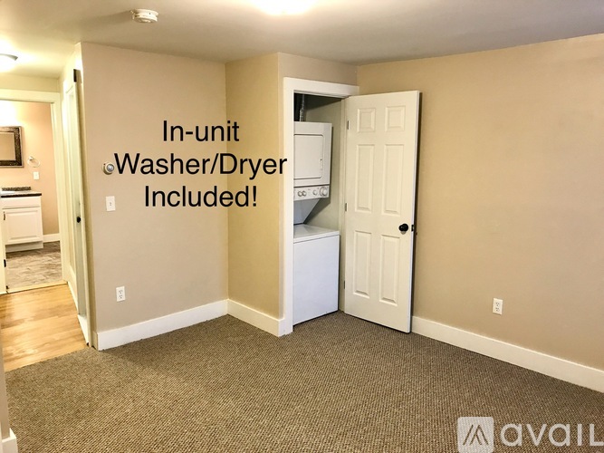 A room with a washer and dryer built in.
