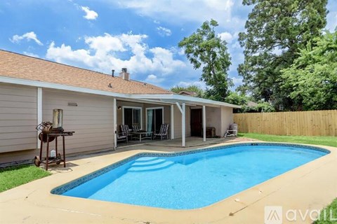 A house with a pool in the backyard.