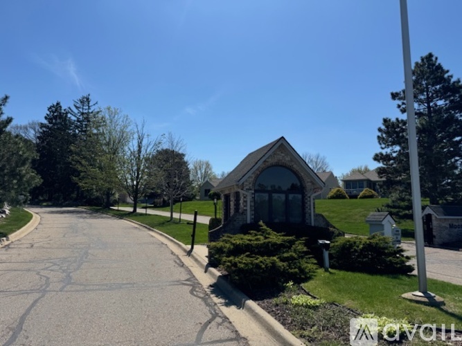 A house with a driveway in front of it.