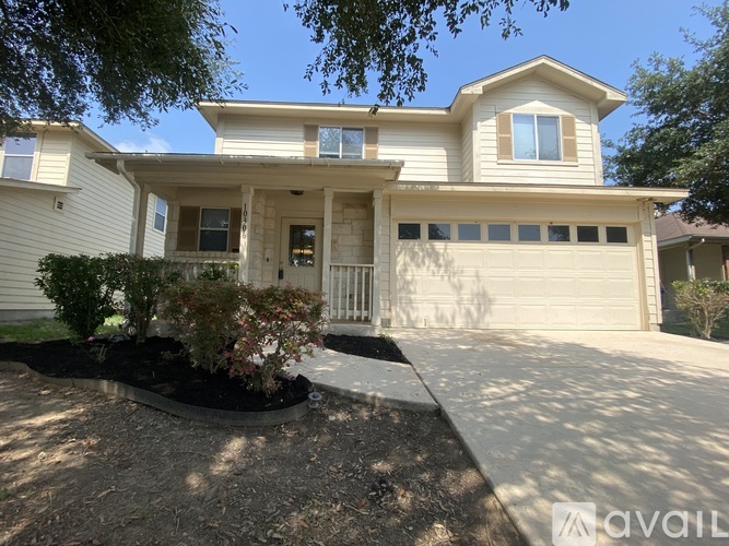 A house with a front yard and a garage.