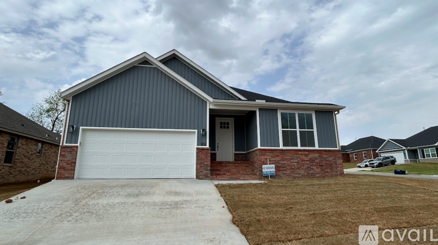 A house with a garage is available for sale.