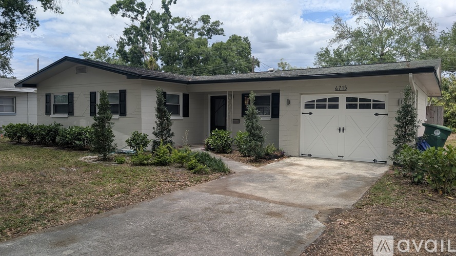 A house with the number 47115 on the garage door.
