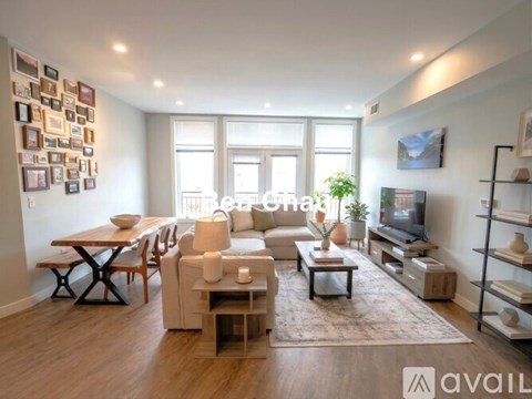 A well-lit living room with a dining table and a couch.