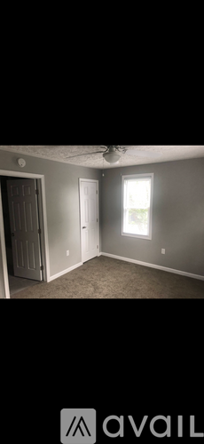 A room with a door and a window.
