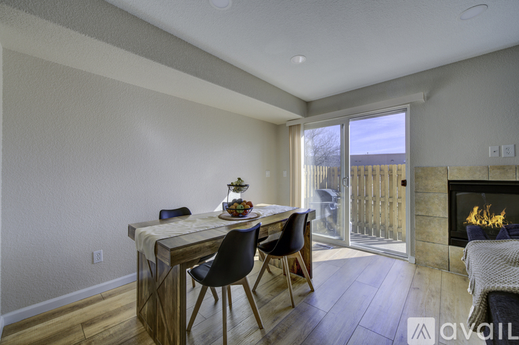 A dining area with a table and chairs is shown.