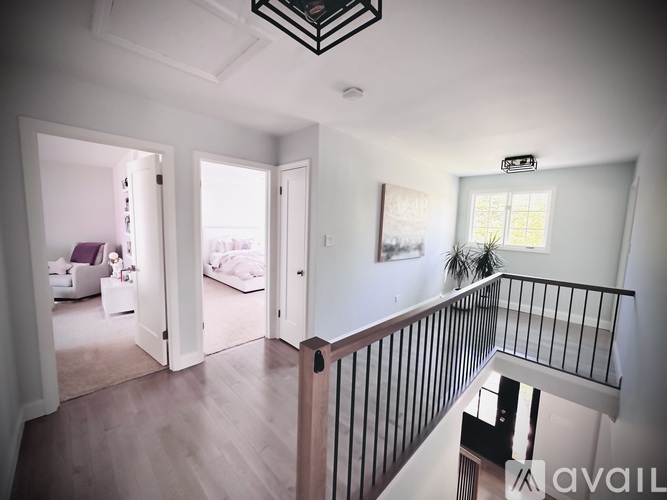 A well-lit, spacious apartment with a balcony and a view of the outdoors.