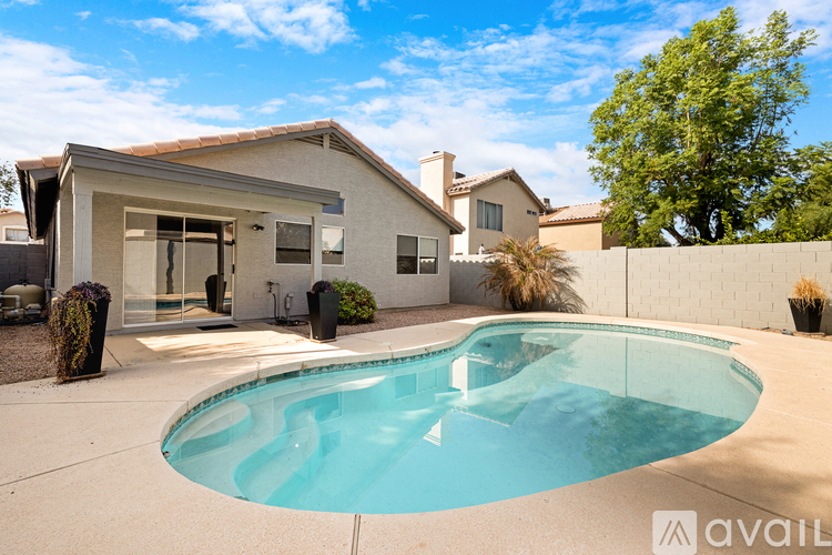 A house with a pool in the backyard.