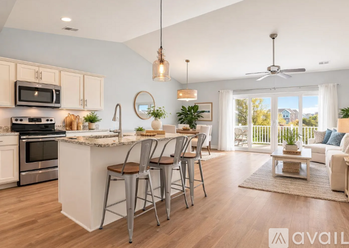 A kitchen with a bar area and a dining table.