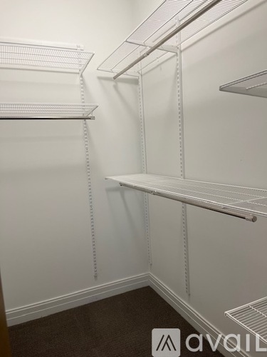 Empty white shelves in a room.