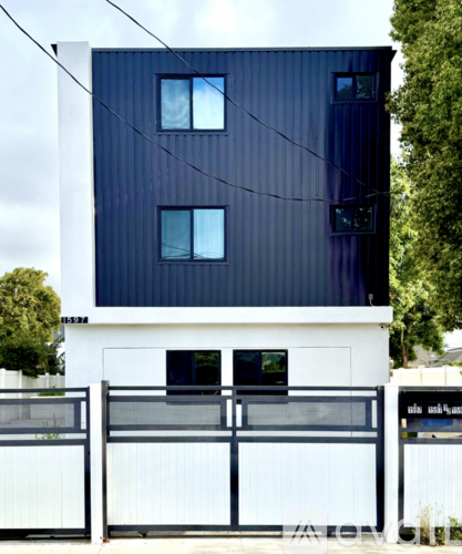 A modern house with a black and white facade.