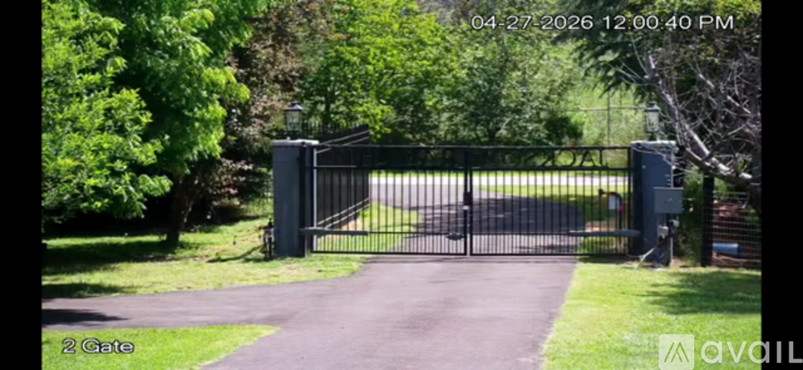 A black gate with the number 2 on it.