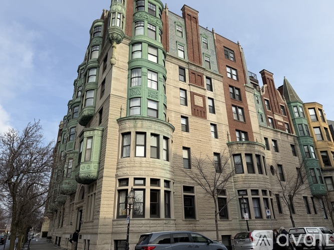 A tall building with many windows and balconies.