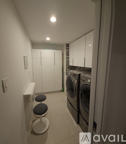 A laundry room with a washer and dryer.