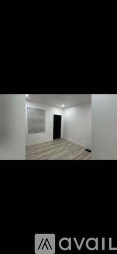 A room with a door and a window.
