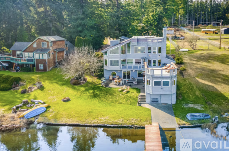 A house with a dock in front of it is for sale.