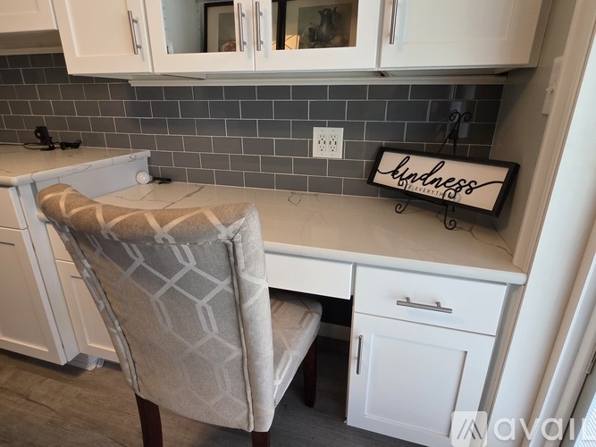 A kitchen with a chair and a sign that says "welness".