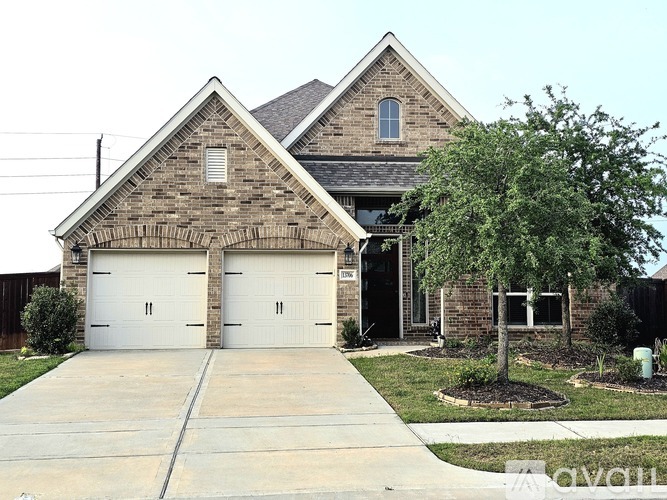 A house with a garage and a driveway.