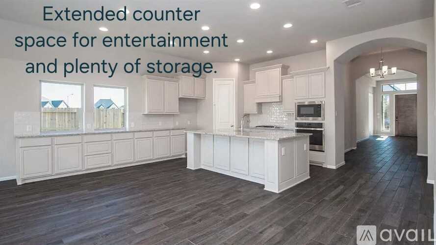 A spacious kitchen with an extended counter space for entertainment and plenty of storage.