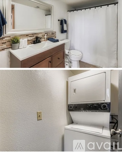 A bathroom with a toilet and a sink.
