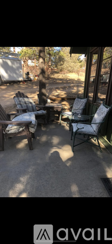 A patio with chairs and a table is shown.