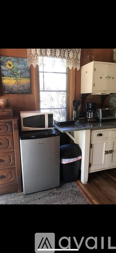 A kitchen with a microwave and a dishwasher.