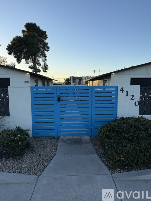 A blue gate with the number 412 on it.