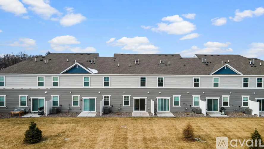 A row of houses with the word "available" written on the grass in front.