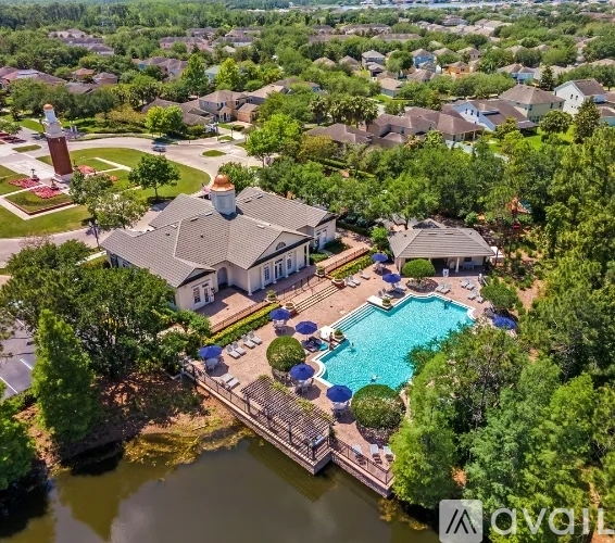 An aerial view of a house with a pool and a gazebo.
