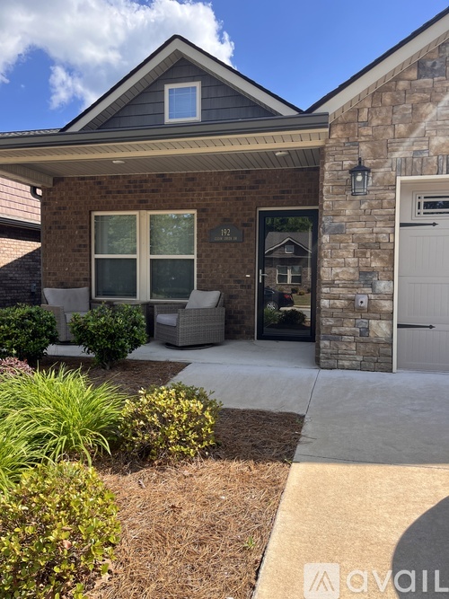 A house with a front yard and a garage.