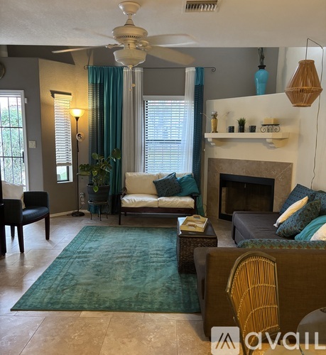 A living room with a fireplace and a couch.