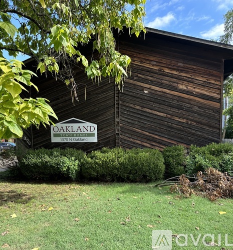 A wooden building with a sign that says Oakland.