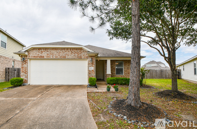 A house with a white garage door is for sale.