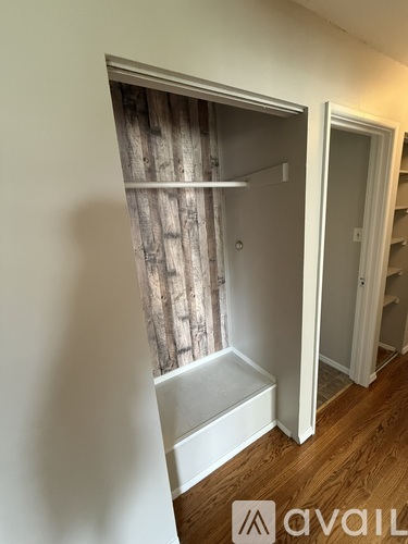A small bathroom with a shower and a toilet.