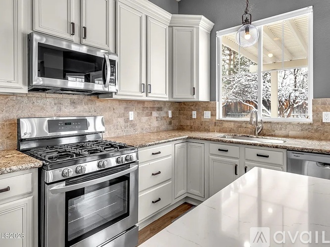 A kitchen with a stove top oven and microwave above it.