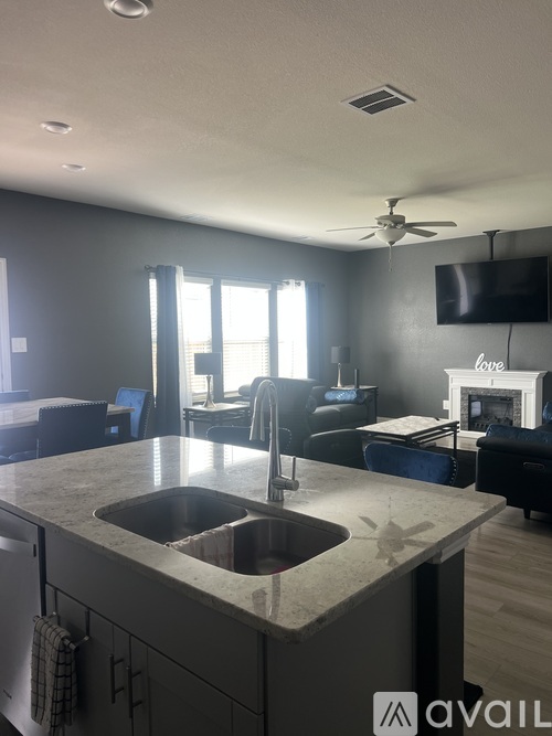 A kitchen with a sink and a countertop.