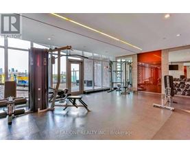 A gym with a view of the city outside the windows.