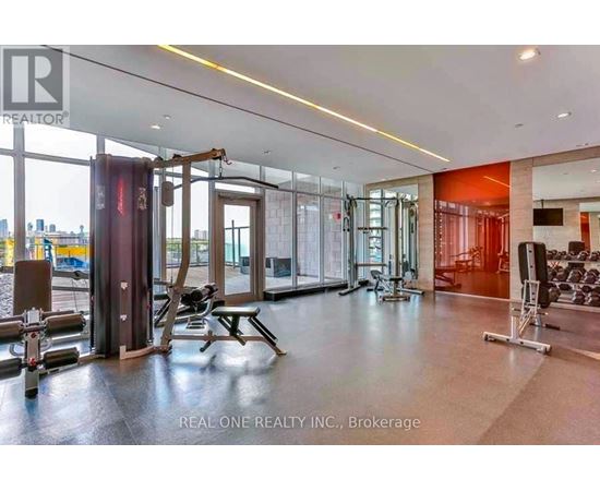 A gym with a view of the city outside the windows.