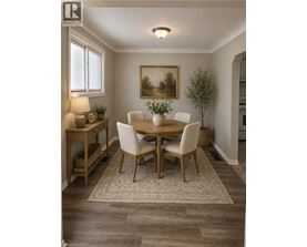 A dining room with a wooden table and chairs.