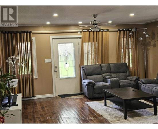 A living room with a grey sofa and a wooden coffee table.
