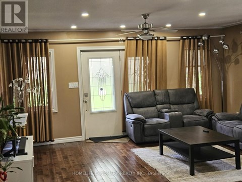 A living room with a grey sofa and a wooden coffee table.