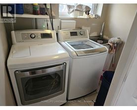 A white dishwasher and oven are in a kitchen.