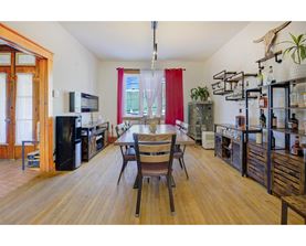 A kitchen with a table and chairs in the middle of the room.