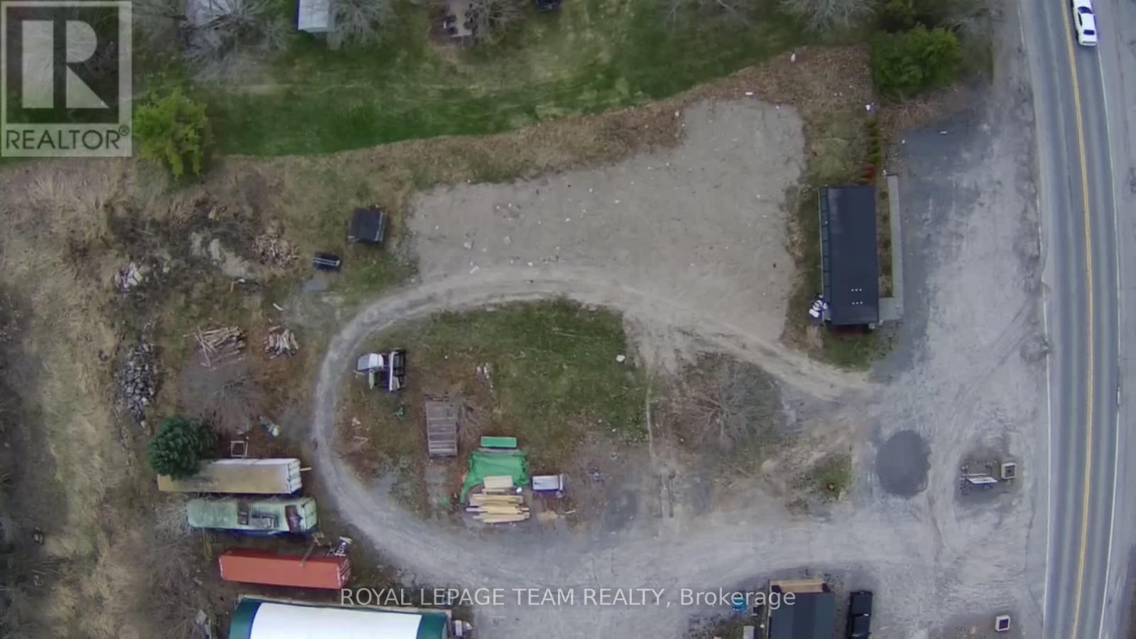 An aerial view of a construction site with a tractor and a truck.