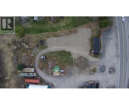 An aerial view of a construction site with a tractor and a truck.
