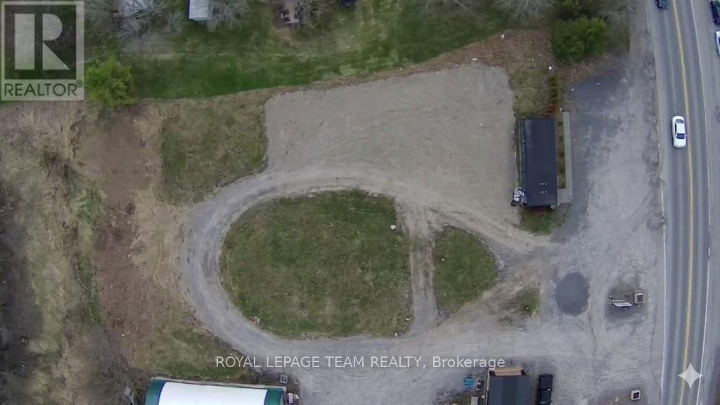 An aerial view of a construction site with a large circular area in the center.