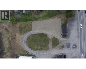 An aerial view of a construction site with a large circular area in the center.